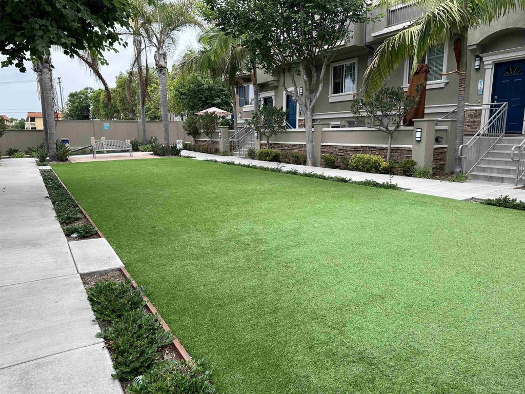 4026 Aidan Circle Carlsbad, CA 92008 - Photo 24 of 26 a front view of a house with a yard table and chairs