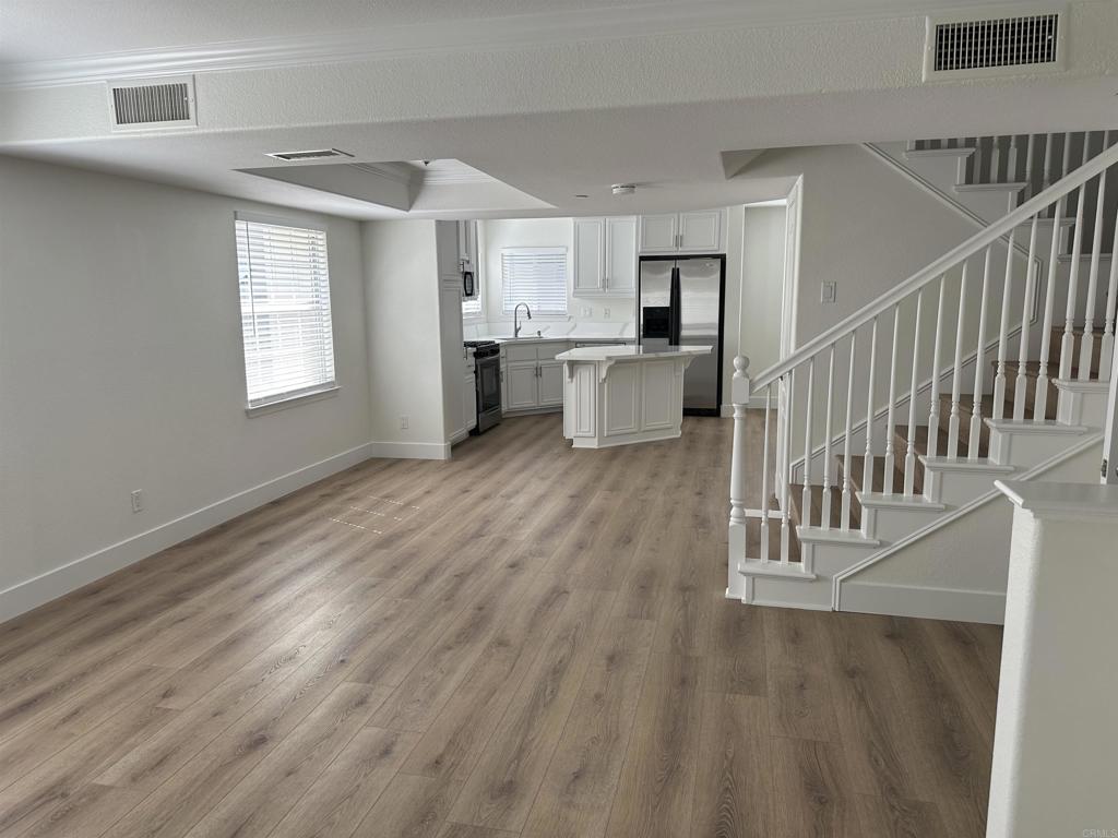 4026 Aidan Circle Carlsbad, CA 92008 - Photo 6 of 26 a view of kitchen with furniture and wooden floor