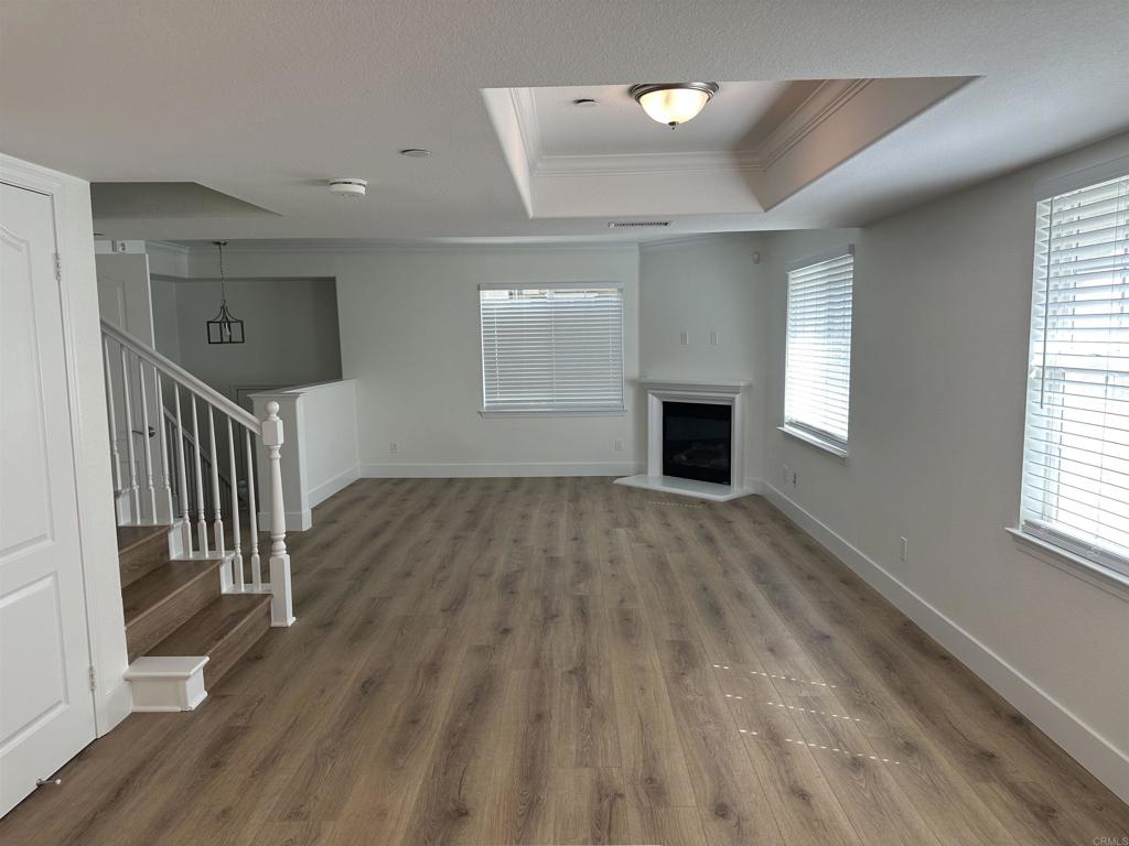 4026 Aidan Circle Carlsbad, CA 92008 - Photo 7 of 26 a view of empty room with wooden floor and fan