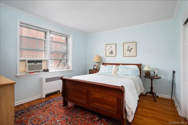 a bed room with a bed and a window