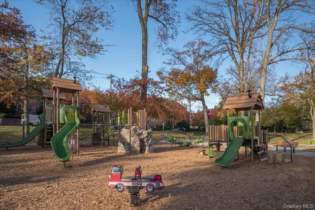 a view of a park with swings and slides