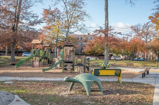 a view of a park with swings and slides