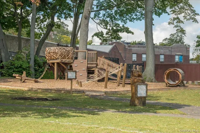 a house view with swimming pool and sitting space