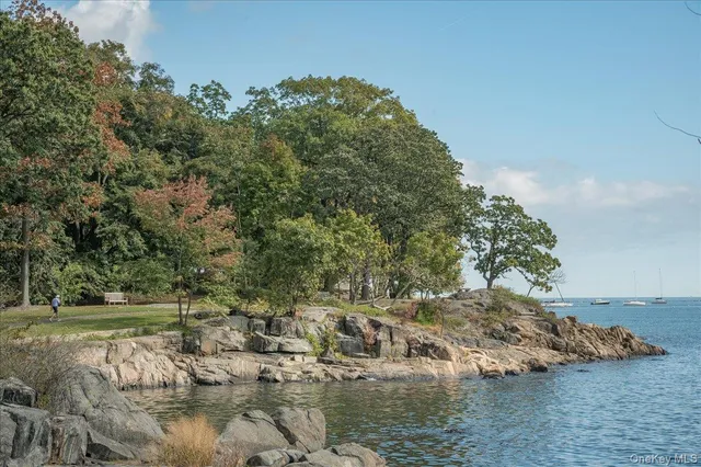 a swimming pool view with a outdoor seating