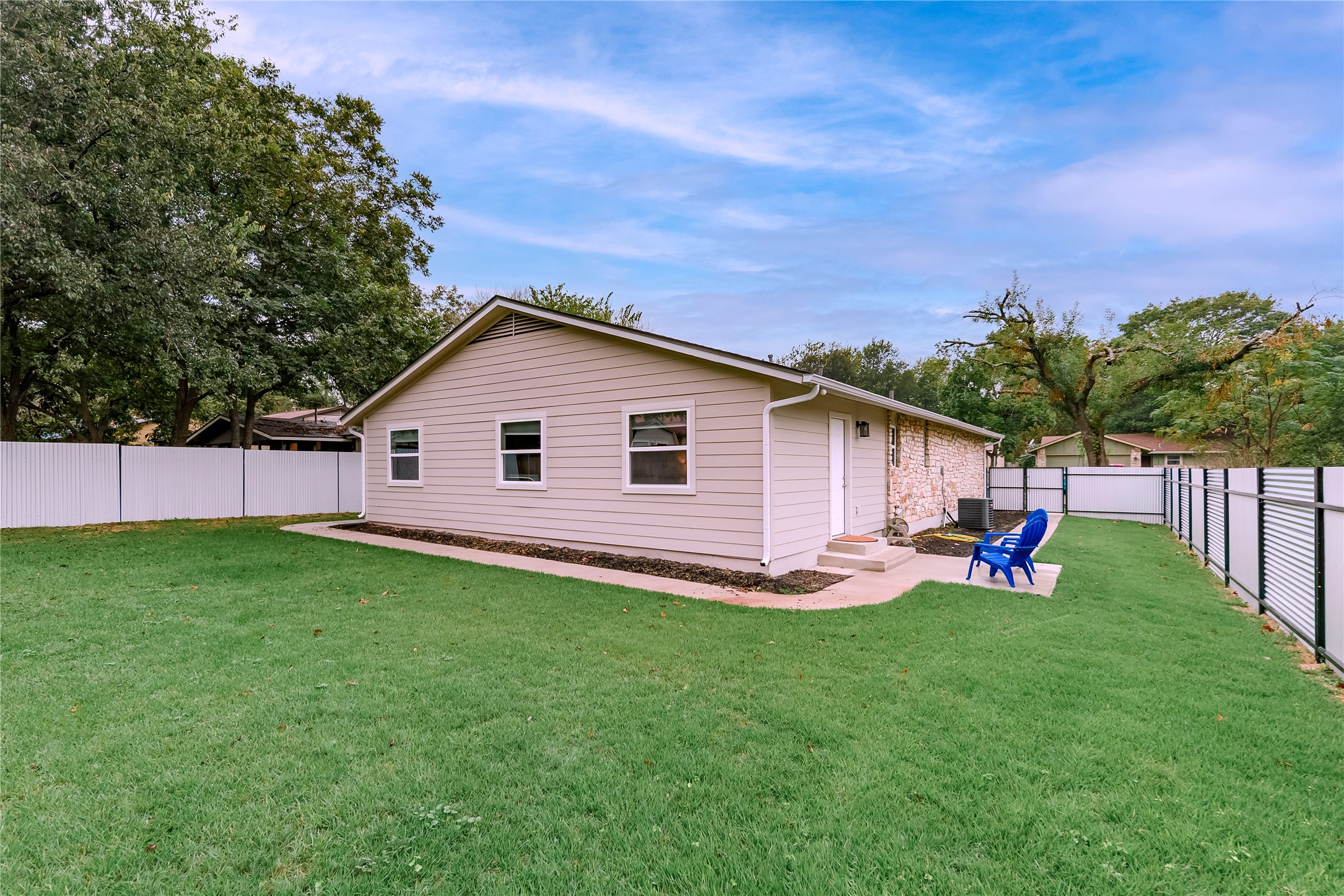 1651 Chippeway Lane Austin, TX 78745 - Photo 25 of 26 a view of a backyard with plants and a garden