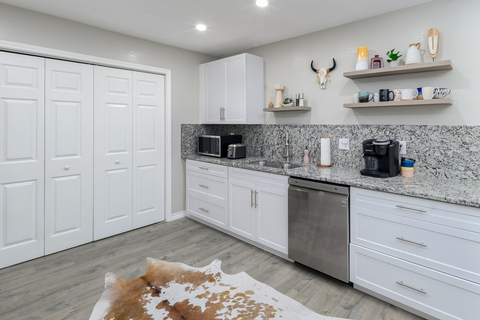 1651 Chippeway Lane Austin, TX 78745 - Photo 8 of 26 a kitchen with stainless steel appliances granite countertop a sink a stove and cabinets