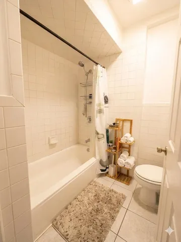 a bathroom with a toilet a sink and bathtub
