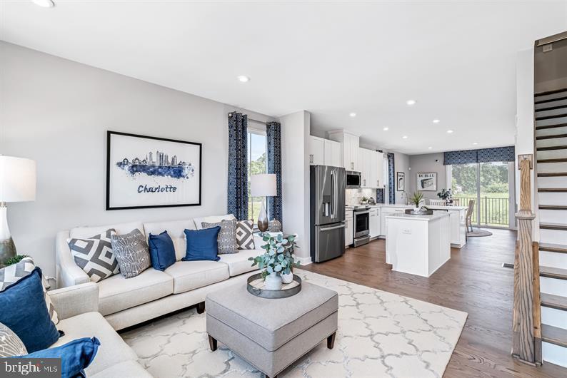 3452 Jacobs Ford Way Hanover, MD 21076 - Photo 11 of 28 a living room with furniture kitchen and a table
