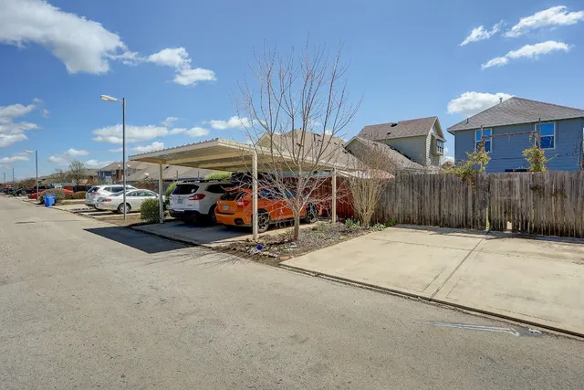a view of a street with a parked car