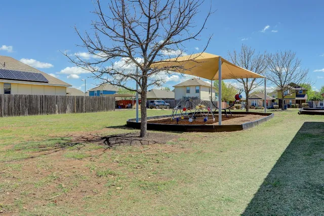 a view of swimming pool with a yard