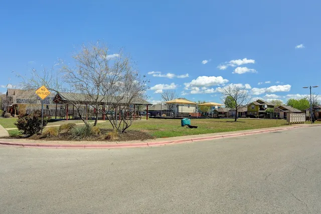 a view of a building with a yard