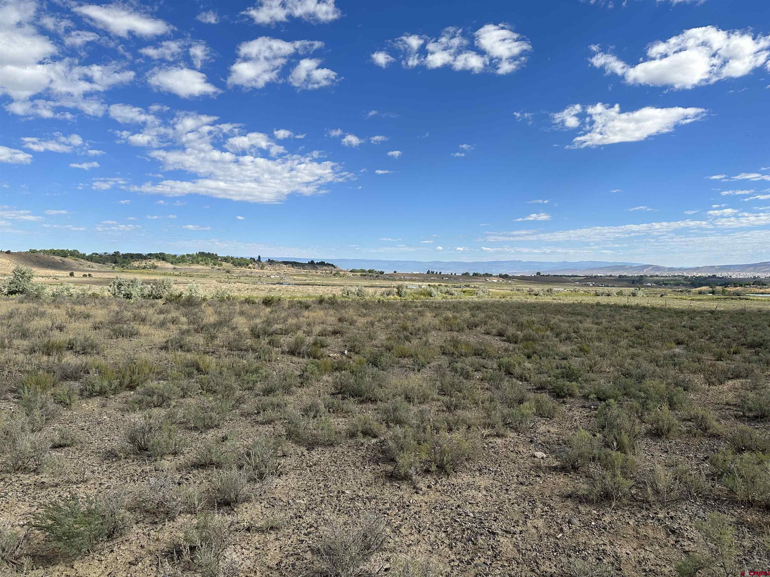 Tbd Jig Road Montrose, CO 81403 - Photo 8 of 8 a view of a lake from a yard