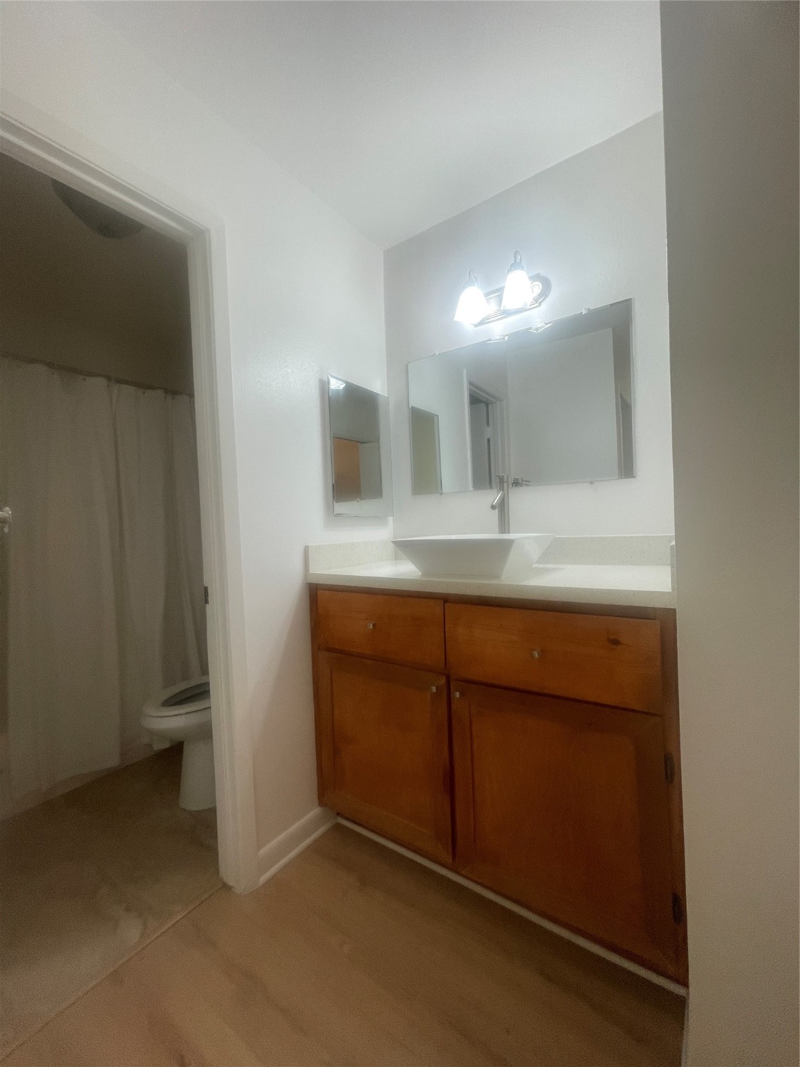 701 Rosedale Street, Unit H Houston, TX 77006 - Photo 13 of 20 a bathroom with a sink and a mirror