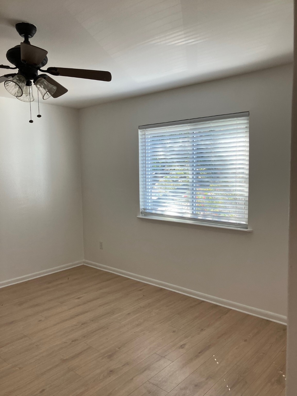 701 Rosedale Street, Unit H Houston, TX 77006 - Photo 19 of 20 a view of an empty room with a window