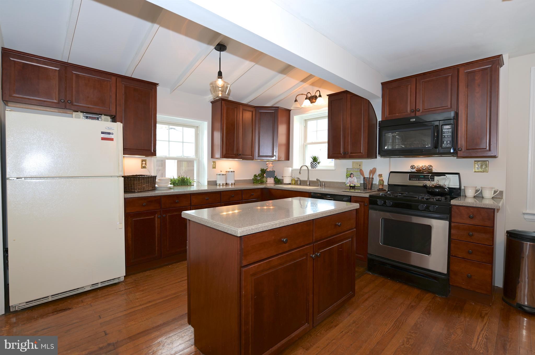 6208 Pimlico Road Baltimore, MD 21209 - Photo 14 of 43 a kitchen with a refrigerator sink and microwave
