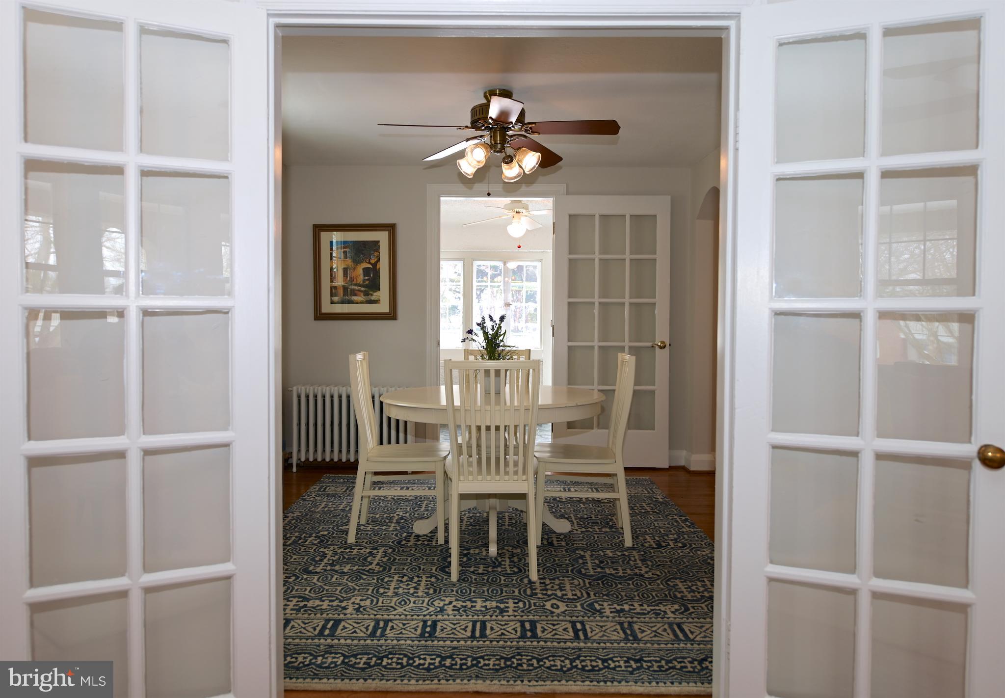 6208 Pimlico Road Baltimore, MD 21209 - Photo 8 of 43 a dining room with chandelier fan and wooden floor