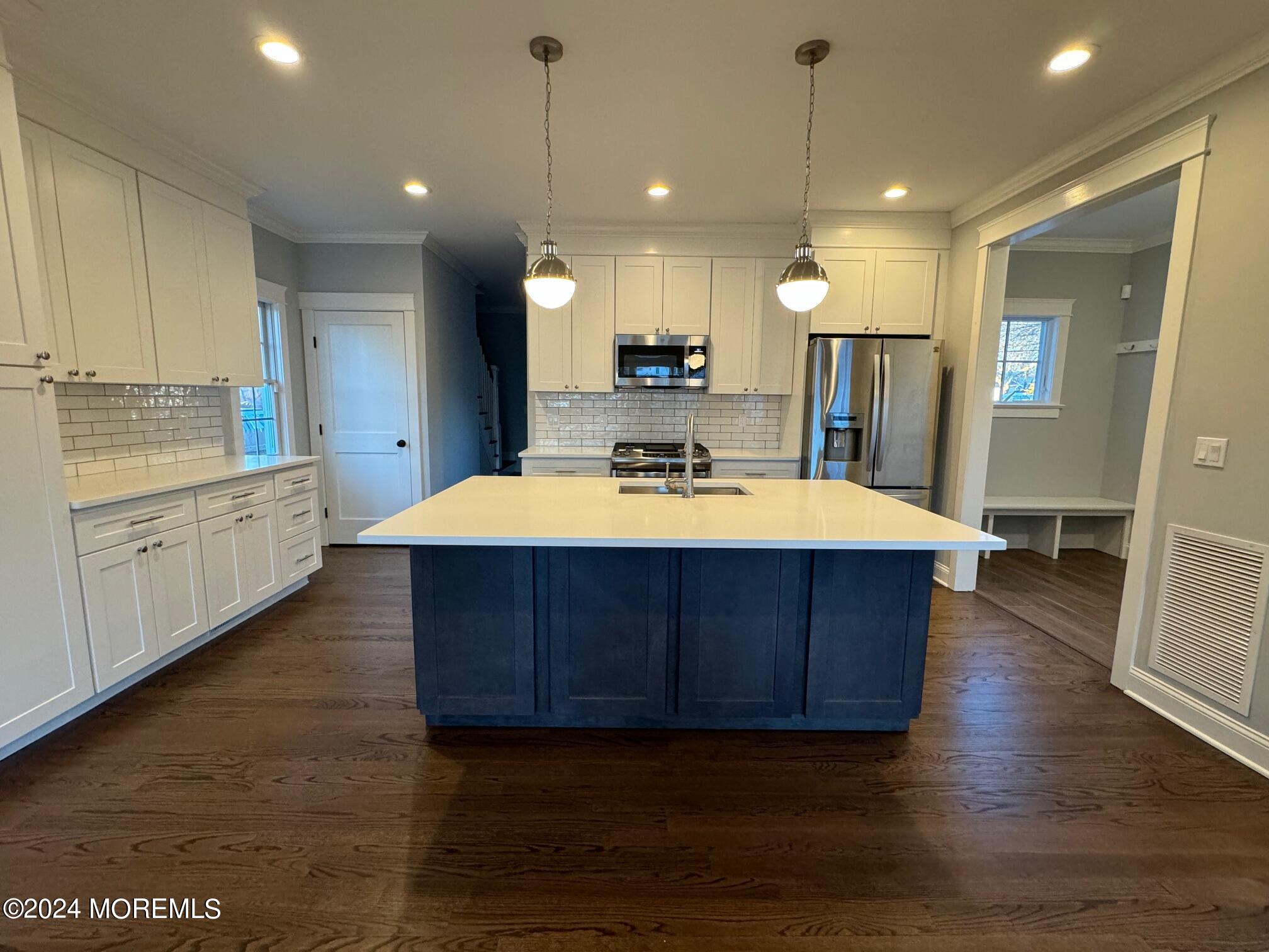 67 Sunset Avenue Red Bank, NJ 07701 - Photo 11 of 39 a large kitchen with stainless steel appliances a large counter space