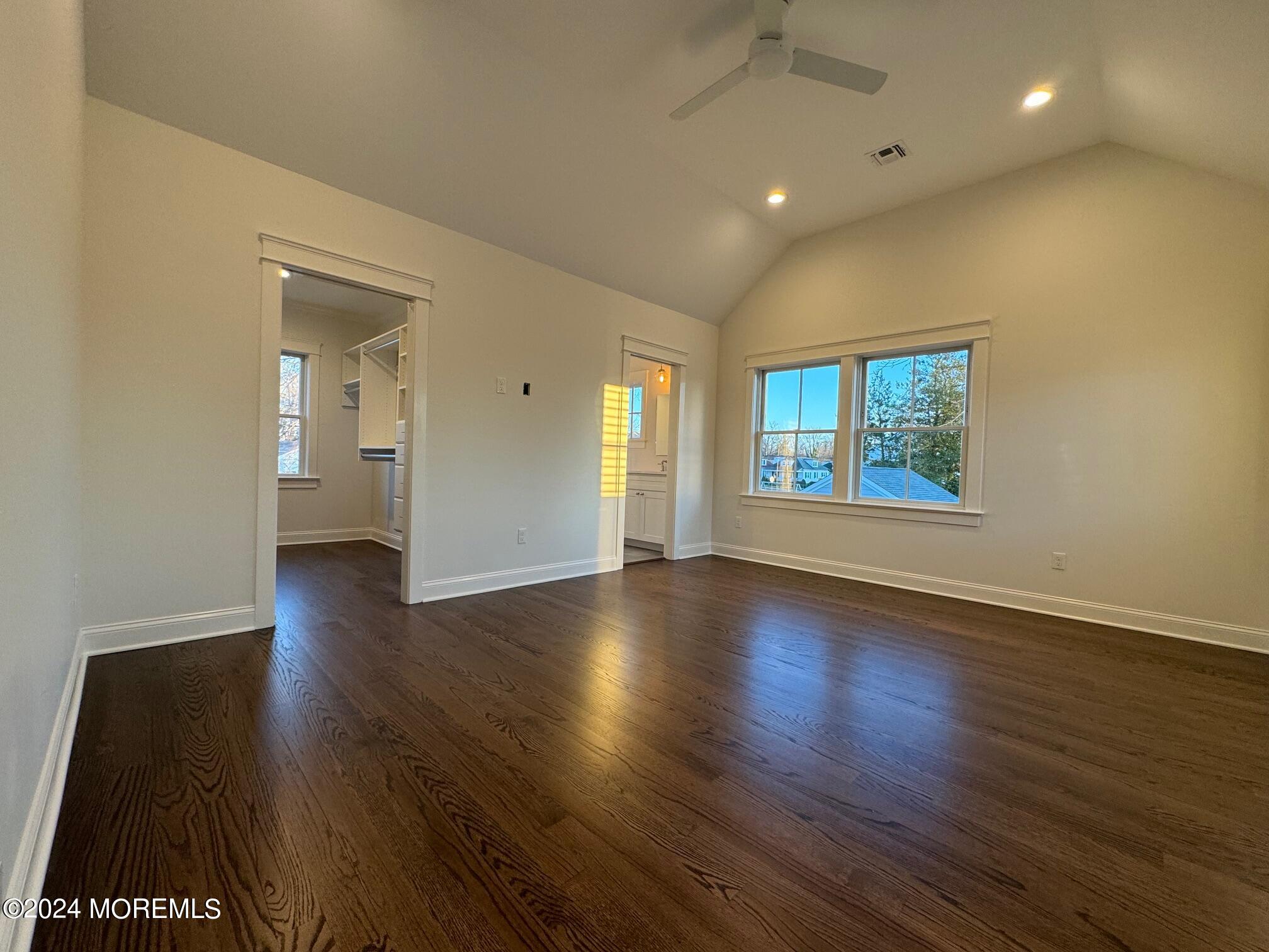 67 Sunset Avenue Red Bank, NJ 07701 - Photo 13 of 39 an empty room with wooden floor and windows