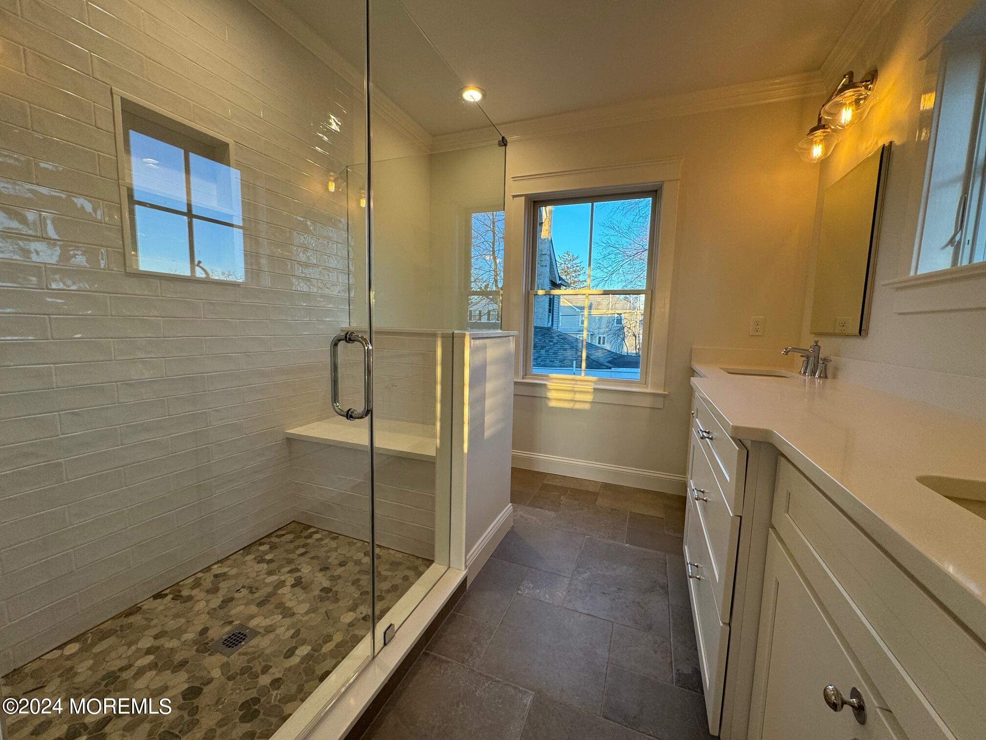 67 Sunset Avenue Red Bank, NJ 07701 - Photo 16 of 39 a bathroom with a sink a toilet and shower