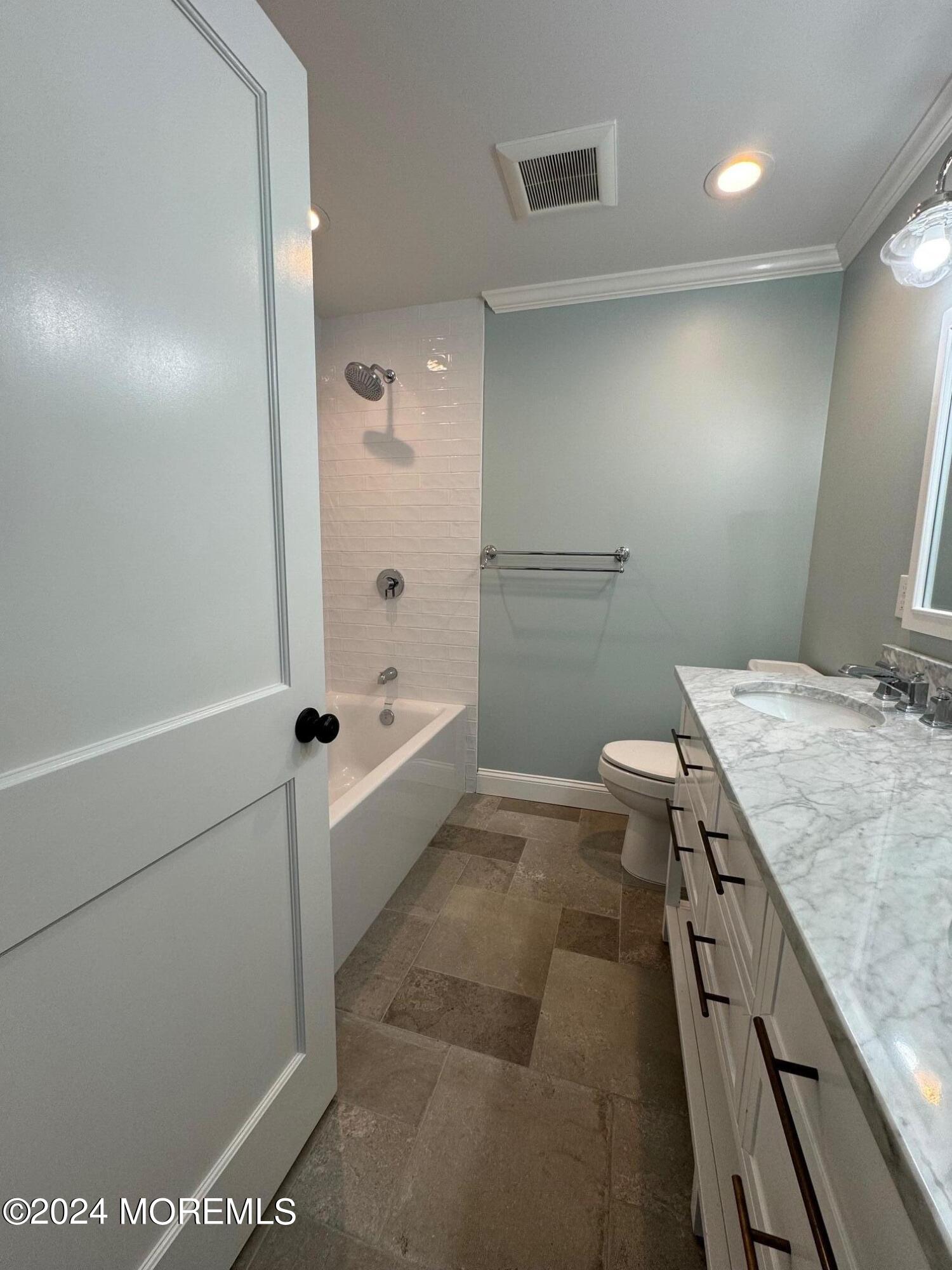 67 Sunset Avenue Red Bank, NJ 07701 - Photo 26 of 39 a bathroom with a granite countertop sink a toilet and bathtub
