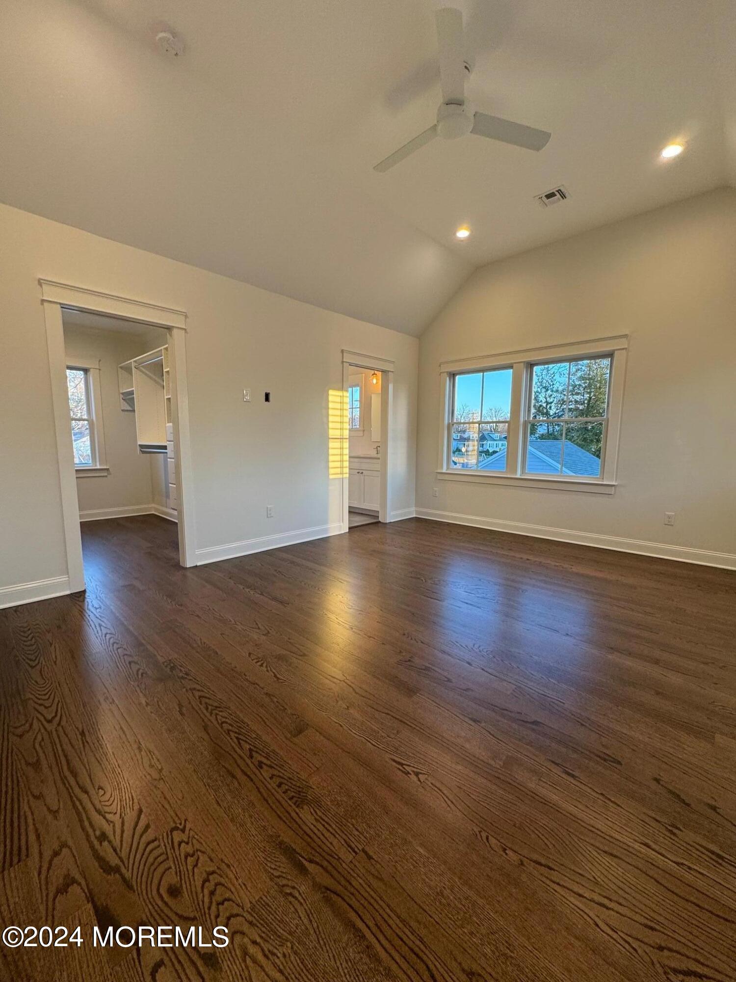 67 Sunset Avenue Red Bank, NJ 07701 - Photo 3 of 39 a view of an empty room with wooden floor and a window