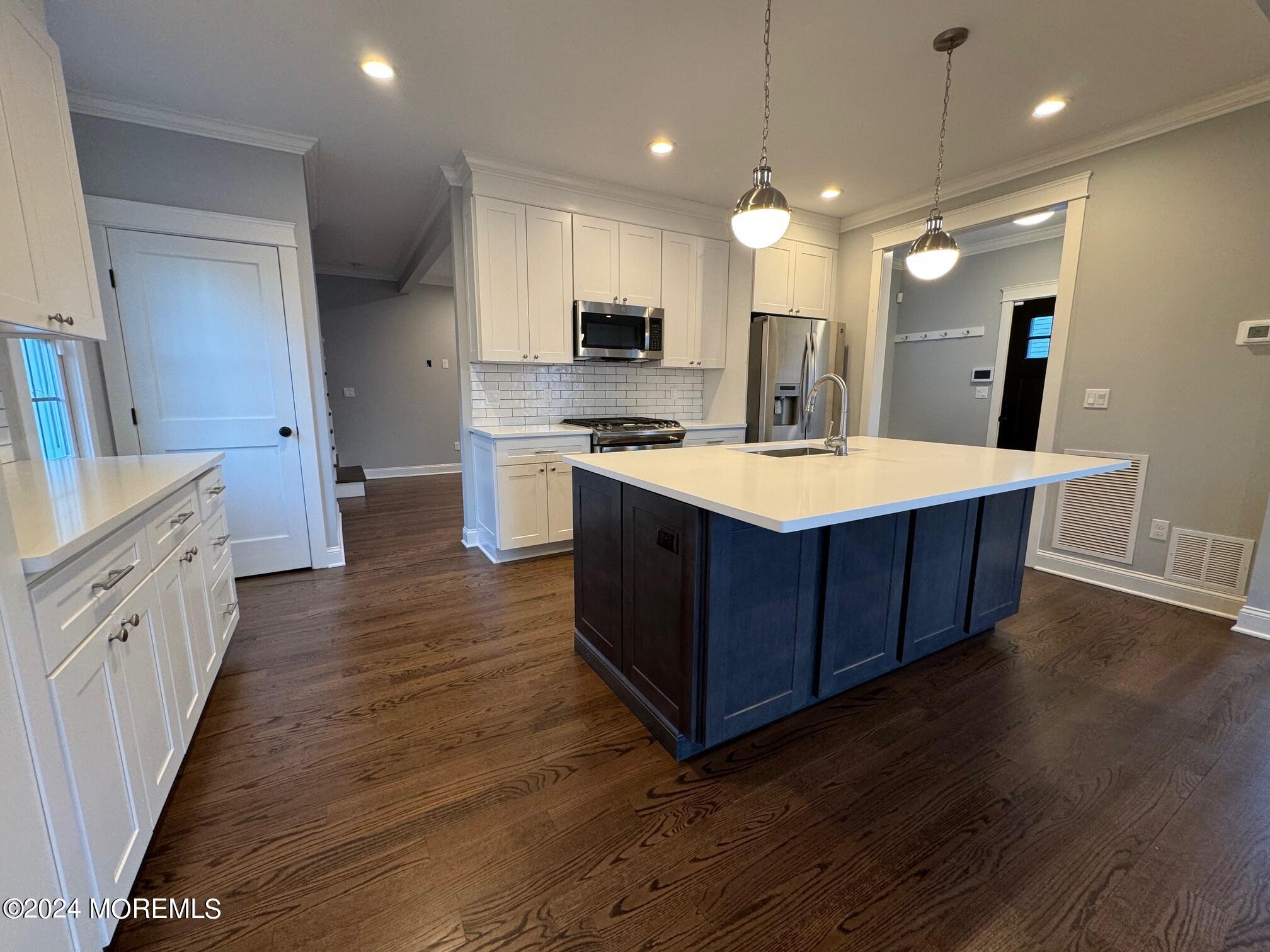 67 Sunset Avenue Red Bank, NJ 07701 - Photo 34 of 39 a kitchen with a sink and a stove top oven