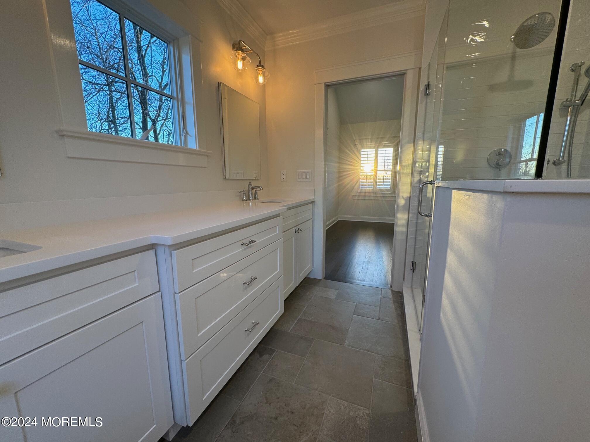 67 Sunset Avenue Red Bank, NJ 07701 - Photo 37 of 39 a bathroom with a double vanity sink and a mirror