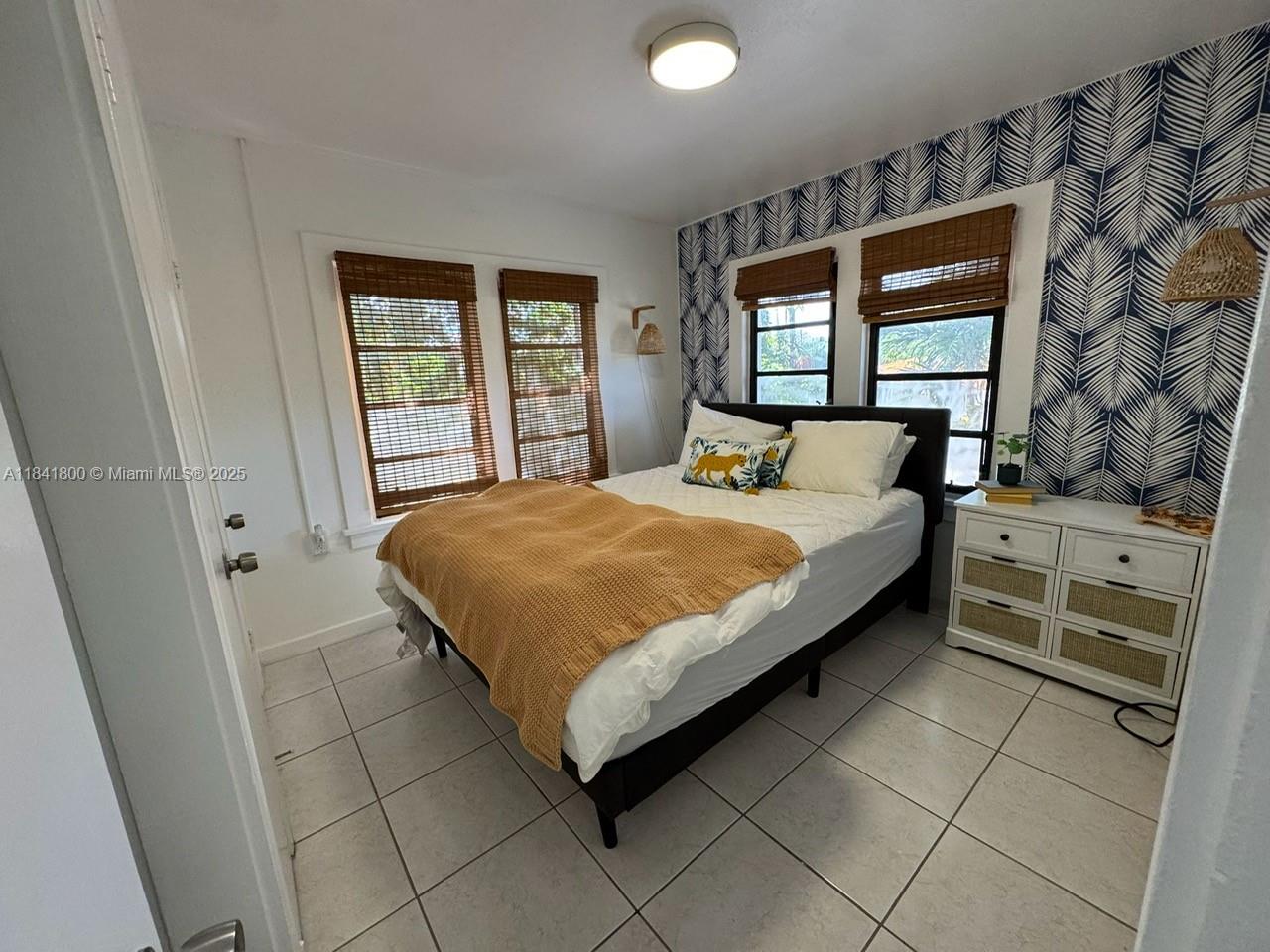 3901 Southwest 6th Street, Unit 1 Miami, FL 33134 - Photo 3 of 6 a bedroom with a bed and a window