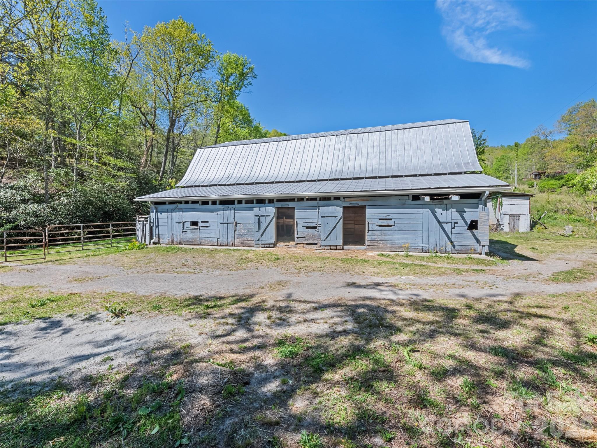 1372 Sand Branch Road Black Mountain, NC 28711 - Photo 24 of 45 a house with trees in the background