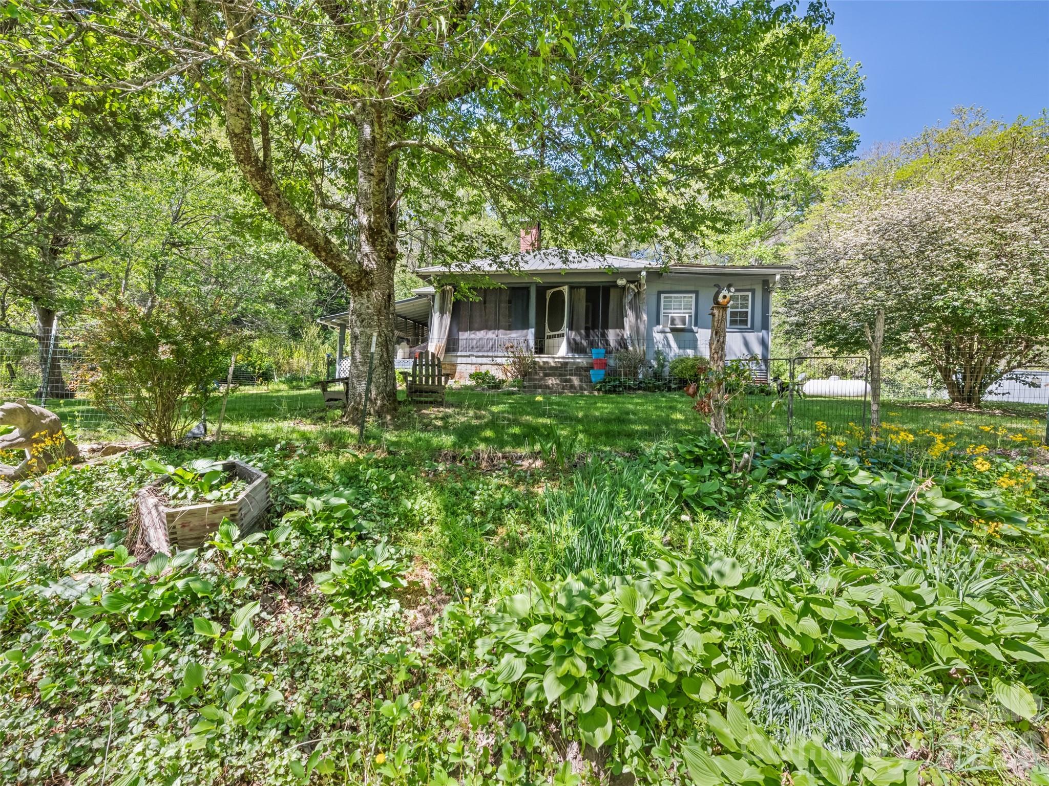 1372 Sand Branch Road Black Mountain, NC 28711 - Photo 37 of 45 a front view of a house with garden