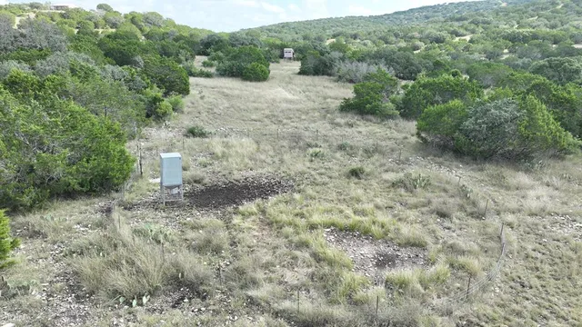 a view of a lake with houses in the back