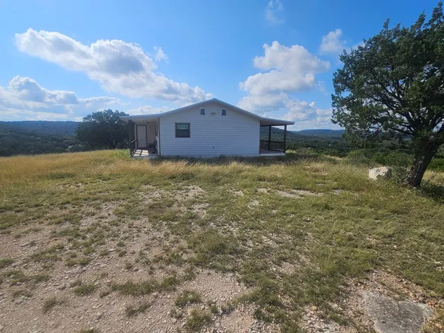 a view of a bathroom with a sink and mirror