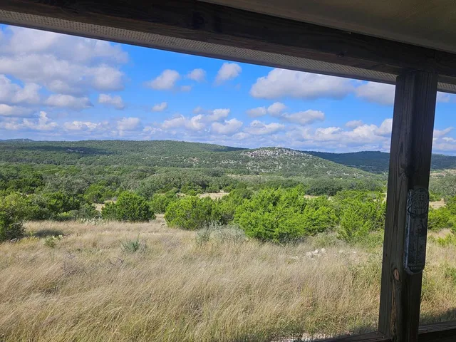 a view of a balcony with chairs