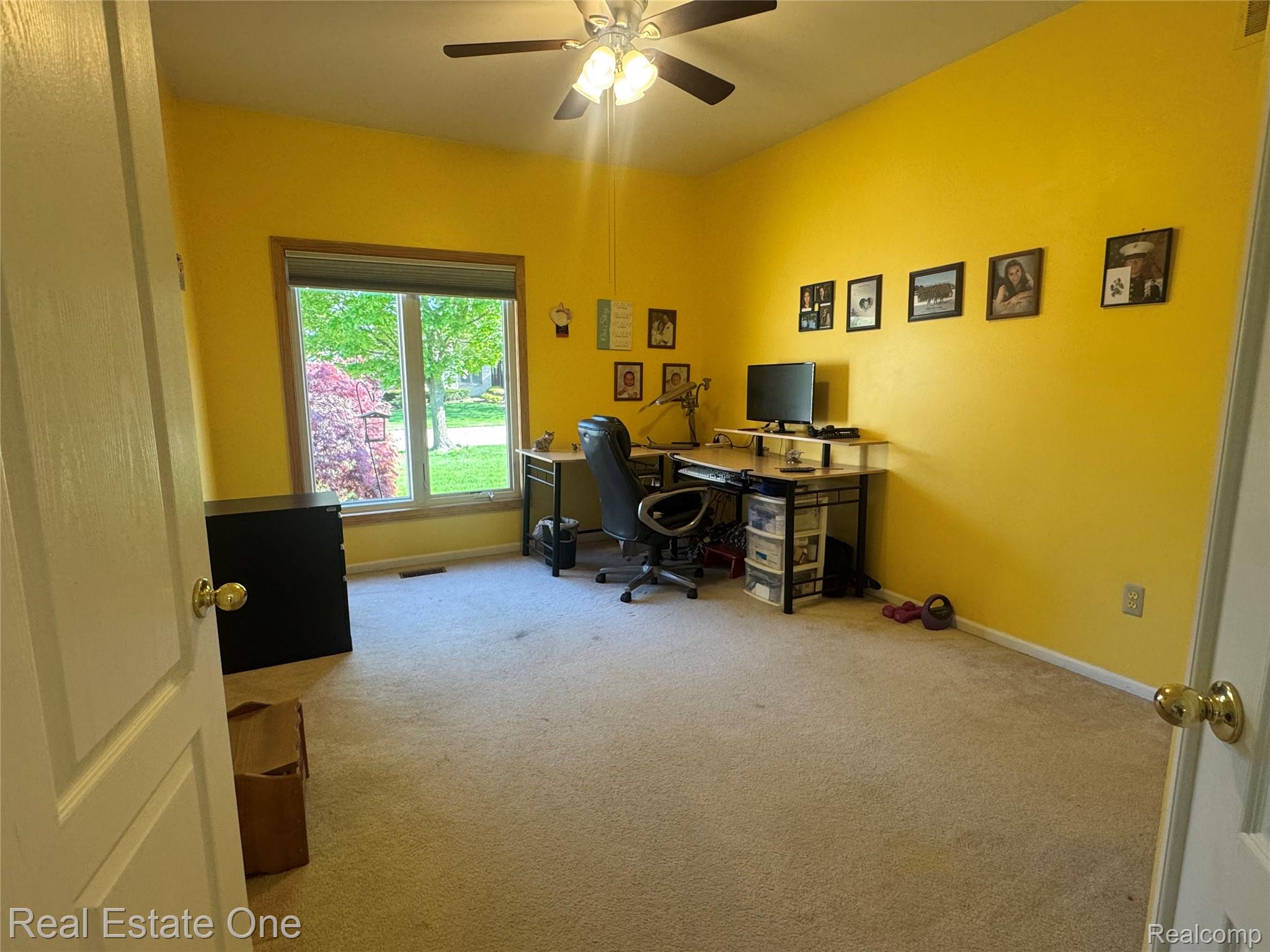 1668 South Shore Drive Rochester, MI 48307 - Photo 19 of 27 Home office with light carpet and a ceiling fan