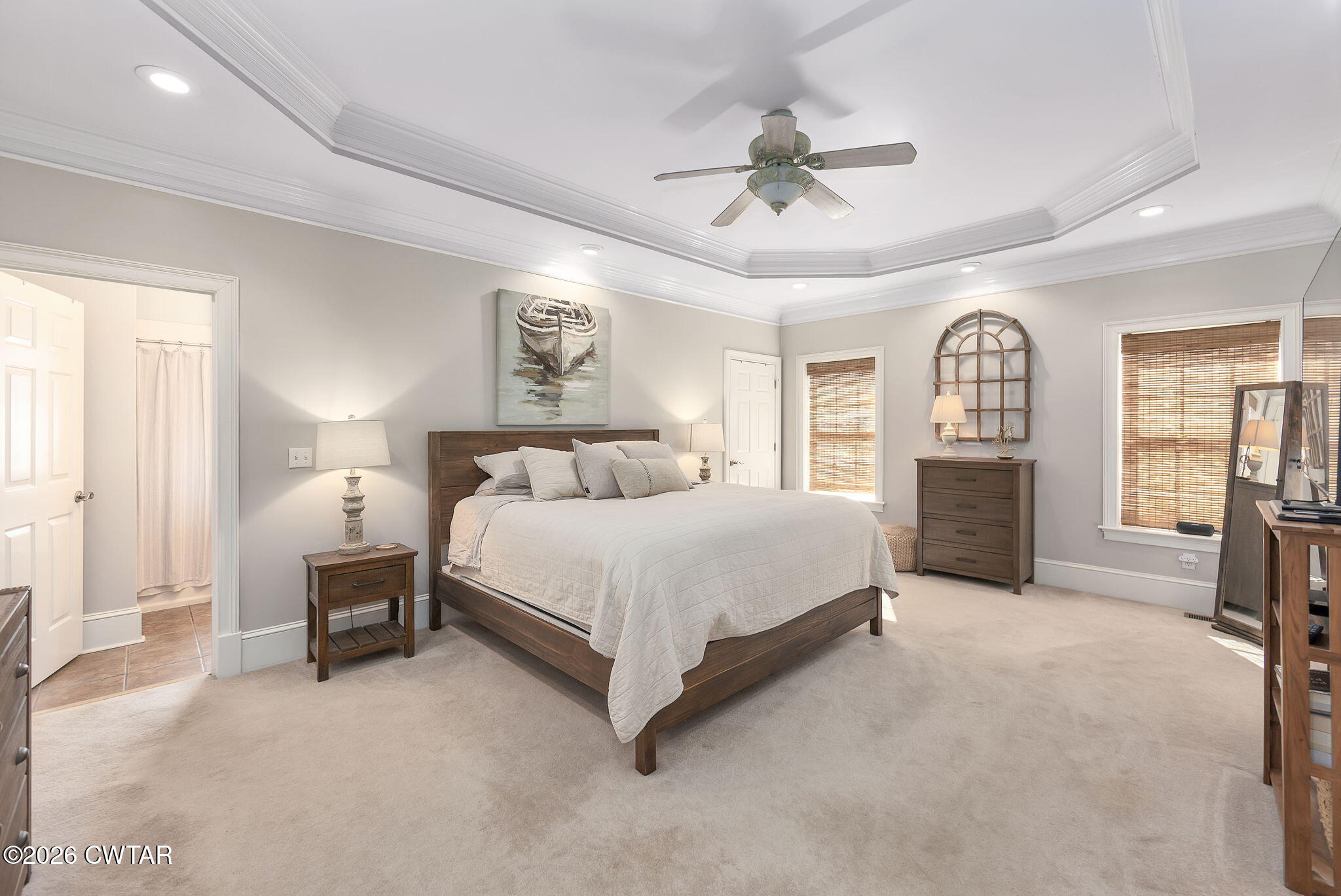 4320 Timberlake-Wildersville Road Lexington, TN 38351 - Photo 16 of 58 a spacious bedroom with a large bed and a chandelier