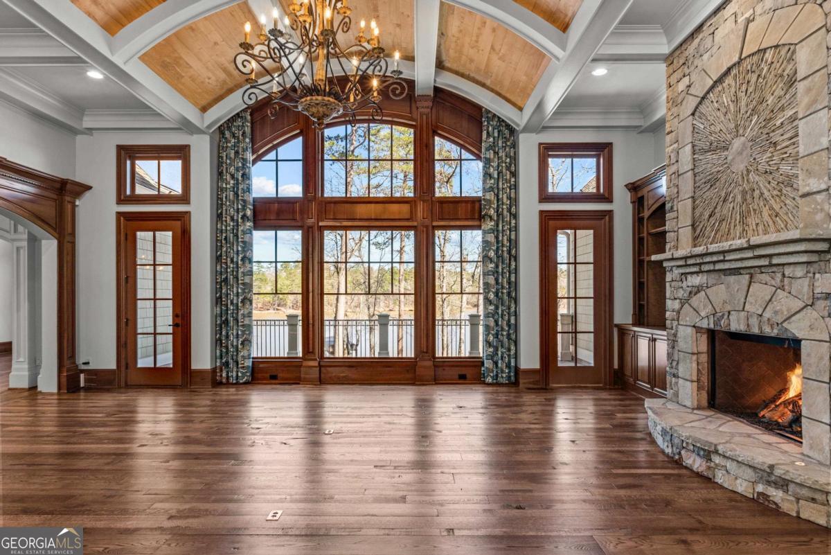 1101 Palmers View Greensboro, GA 30642 - Photo 13 of 72 a view of an entryway with wooden floor and a fireplace