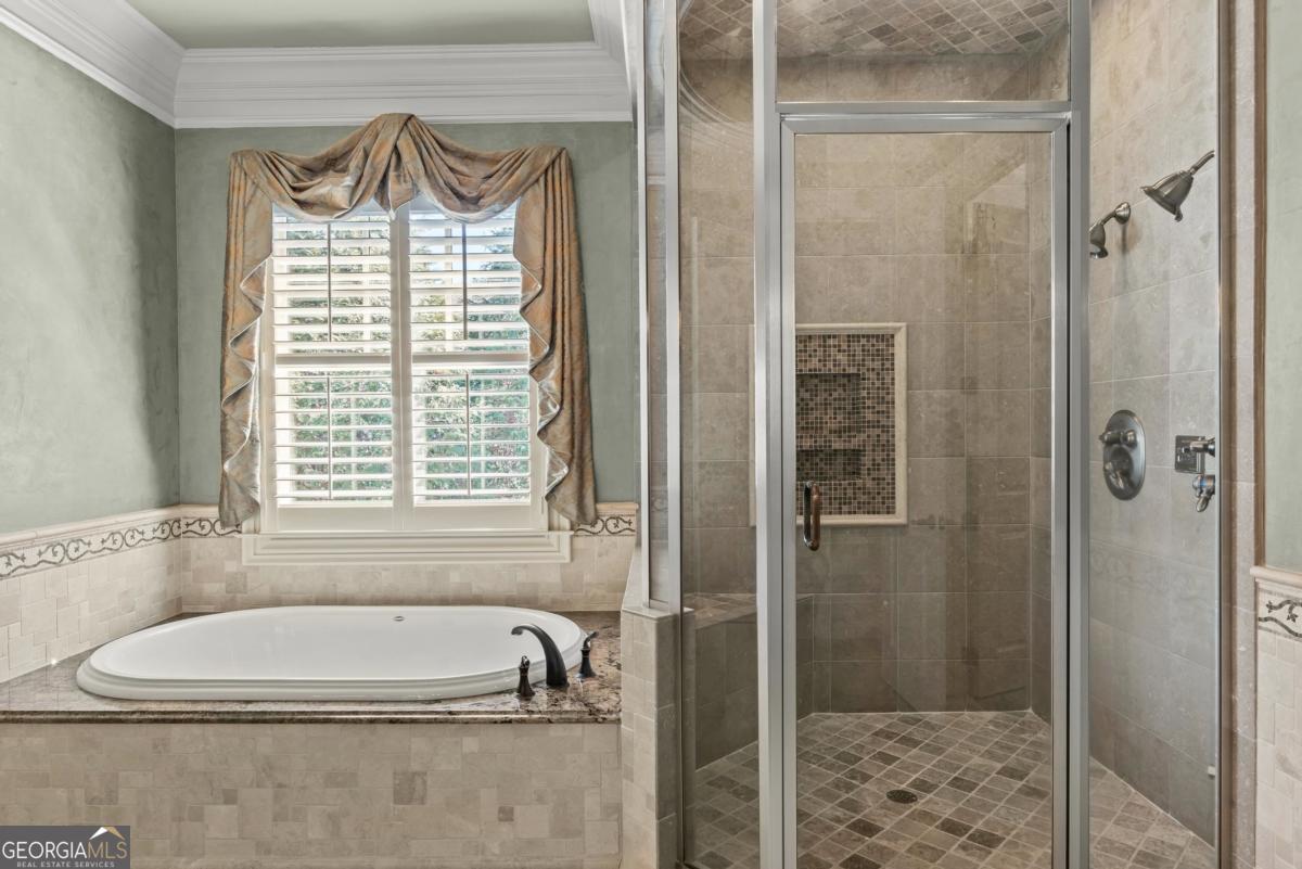1101 Palmers View Greensboro, GA 30642 - Photo 42 of 72 a bathroom with a bathtub and a shower