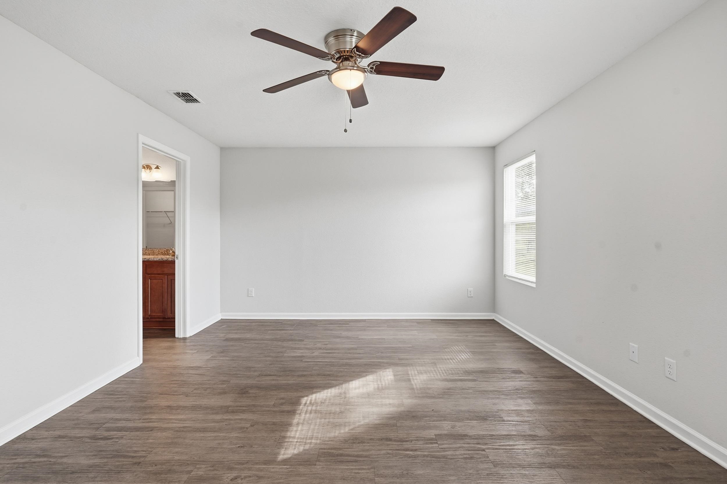 8772 Kaye Lane Jacksonville, FL 32244 - Photo 14 of 35 Spare room with dark wood-style flooring and a ceiling fan