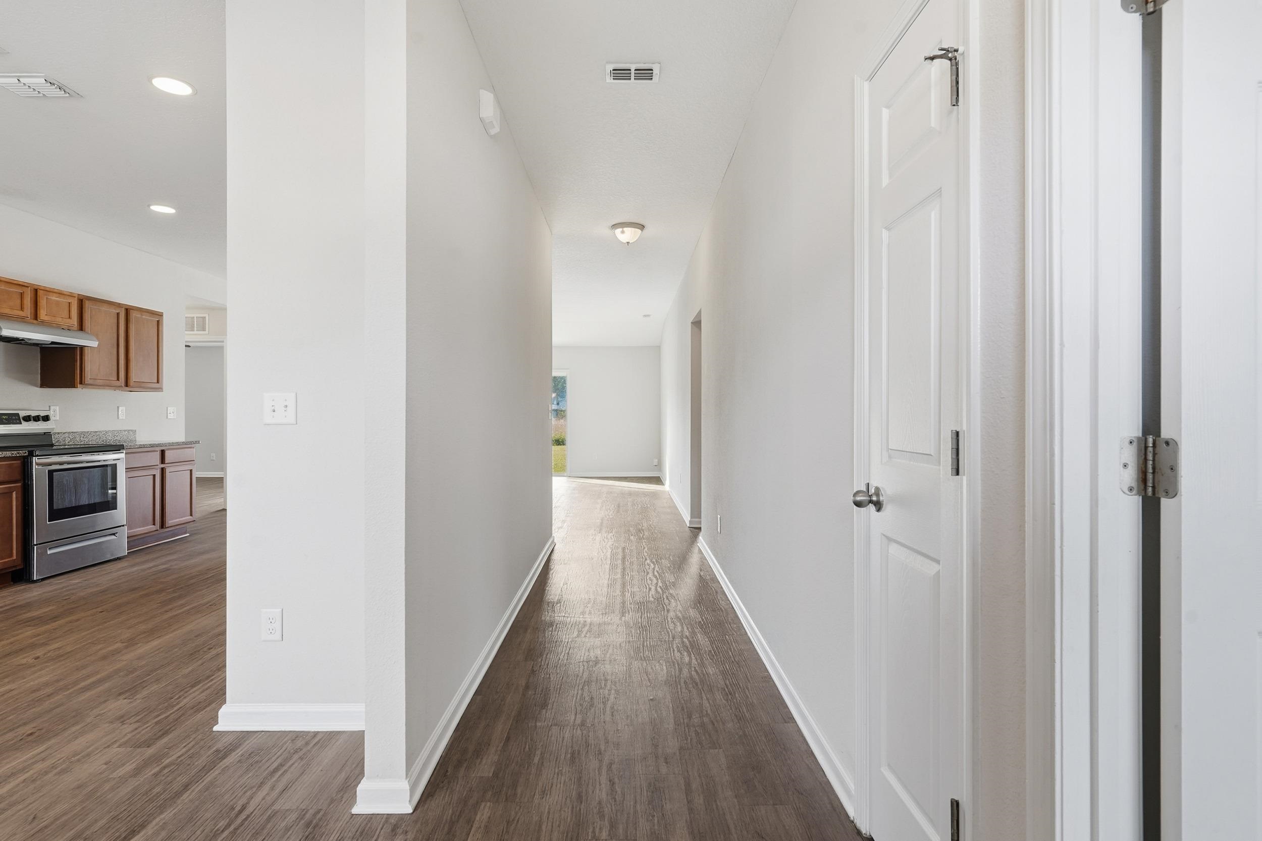 8772 Kaye Lane Jacksonville, FL 32244 - Photo 31 of 35 Hall featuring dark wood-style flooring and recessed lighting