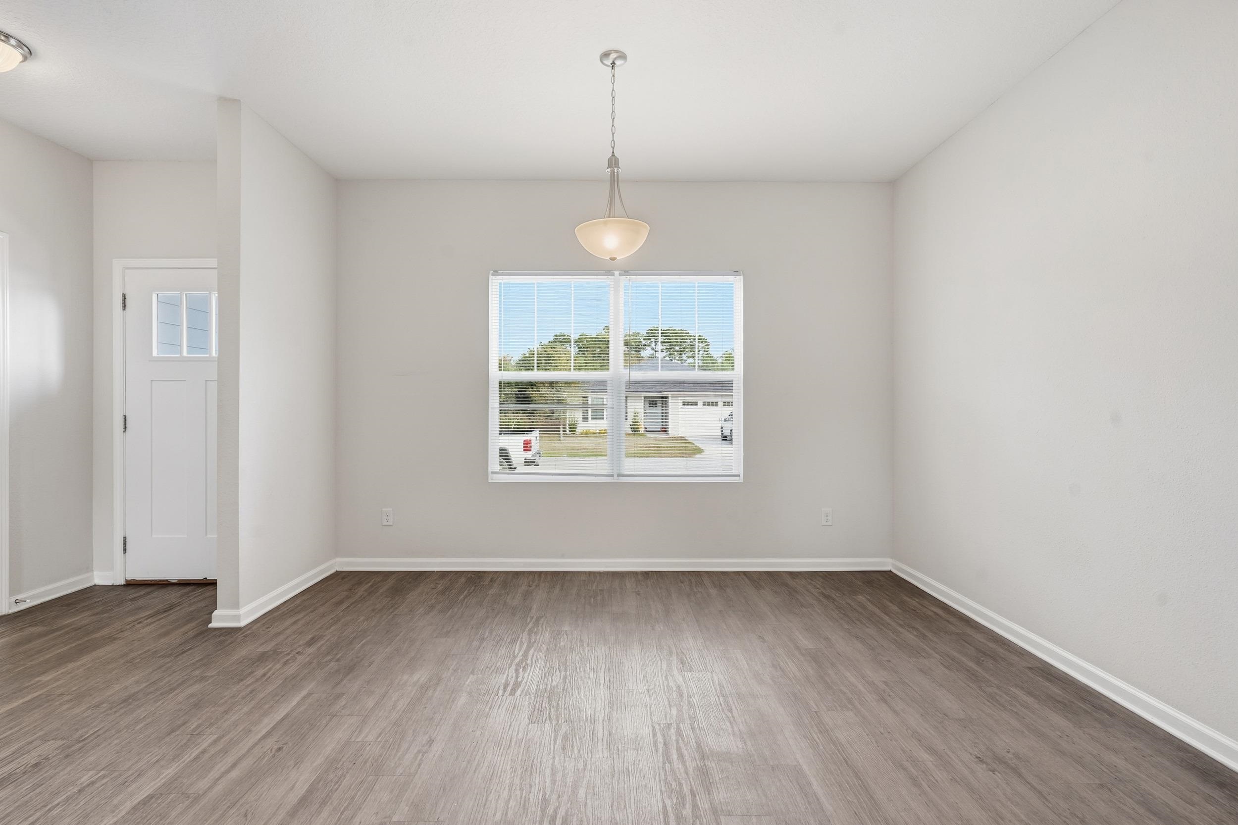 8772 Kaye Lane Jacksonville, FL 32244 - Photo 33 of 35 Unfurnished dining area featuring wood finished floors and baseboards