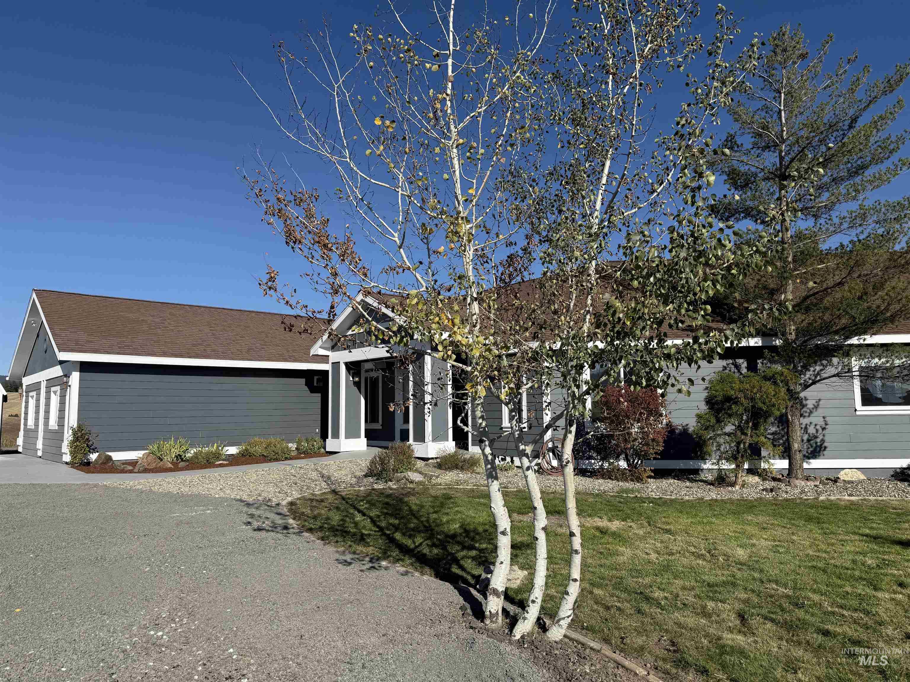 1030 Reams Road Moscow, ID 83843 - Photo 3 of 50 Ranch-style house with a front yard, a garage, and driveway