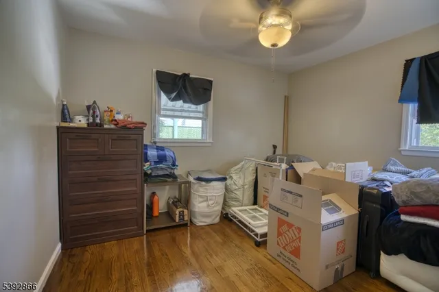 a bed room with bed and a window