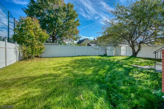 a view of backyard with a garden and entertaining space