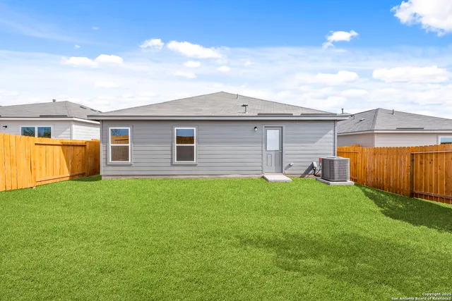 a backyard of a house with lots of green space