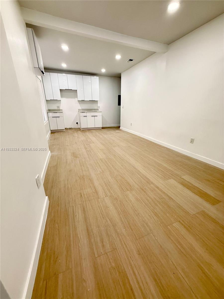 125 Southwest 19th Avenue, Unit 2 Miami, FL 33135 - Photo 4 of 8 a view of kitchen with wooden floor