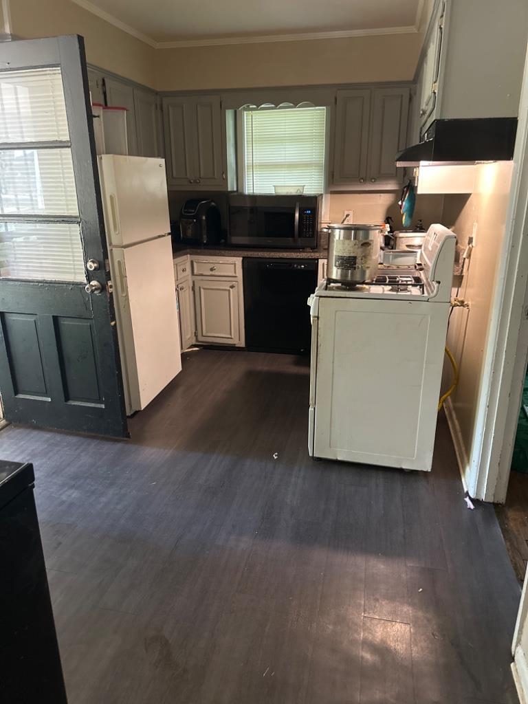 5369 Lochinvar Road Memphis, TN 38116 - Photo 10 of 11 a kitchen with a refrigerator and window