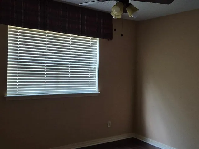 a view of a room that has a window in it