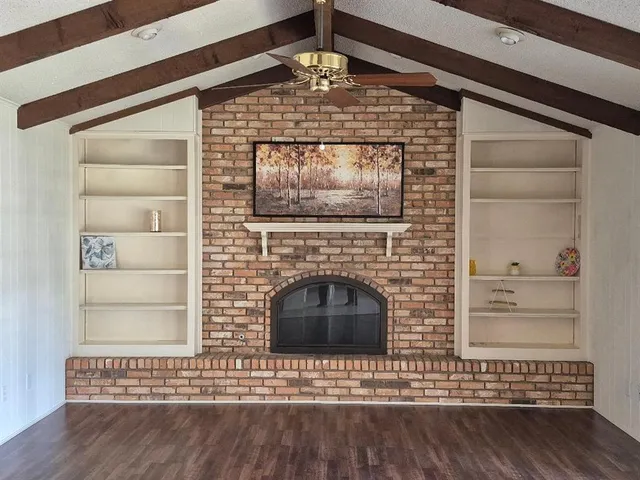 a view of fireplace and wooden floor