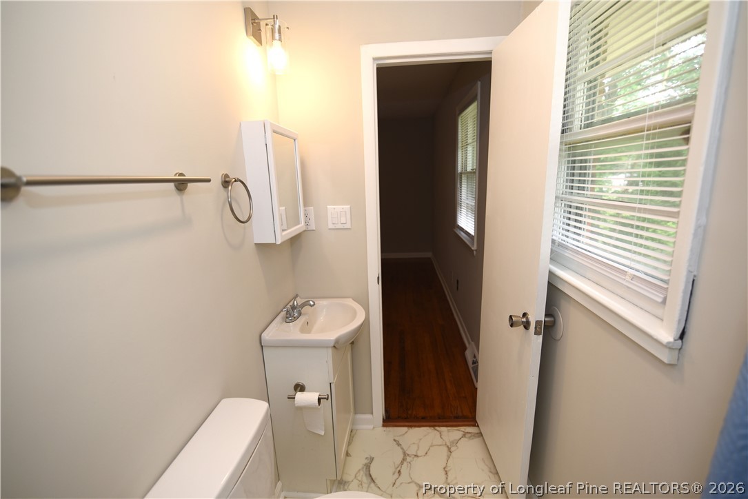 1673 Norment Road Lumberton, NC 28360 - Photo 21 of 32 a bathroom with a toilet and a shower