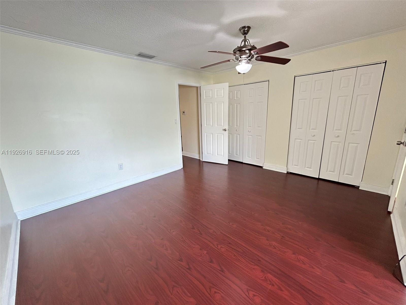 13444 Southwest 62nd Street, Unit 104F Miami, FL 33183 - Photo 37 of 40 a view of an empty room with wooden floor